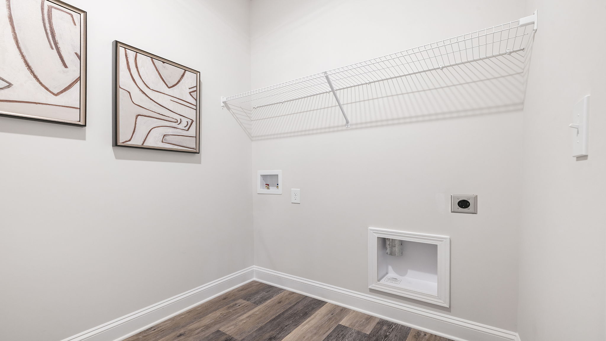 Laundry room with shelf.