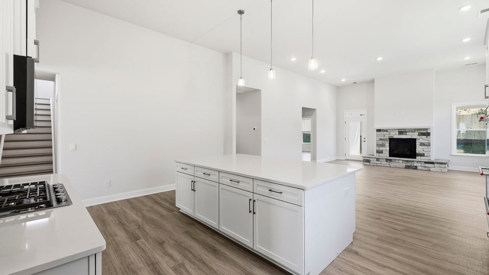 Kitchen with island and cabinets.