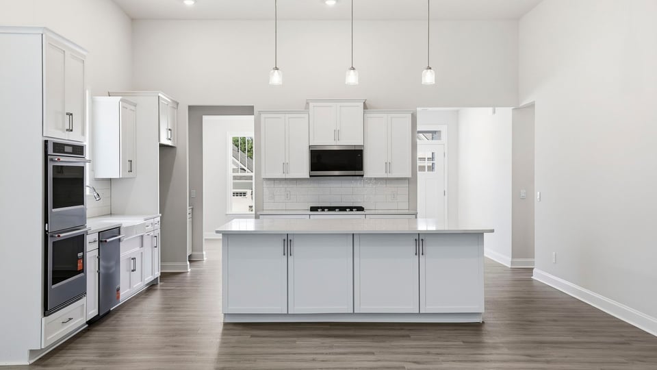 Kitchen with island and cabinets.