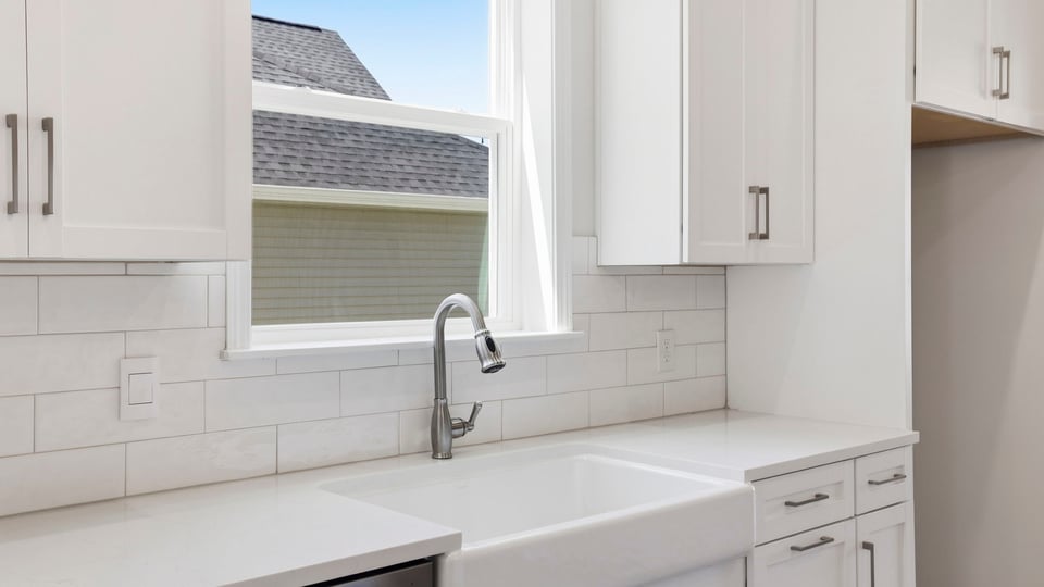 Kitchen with island and cabinets.