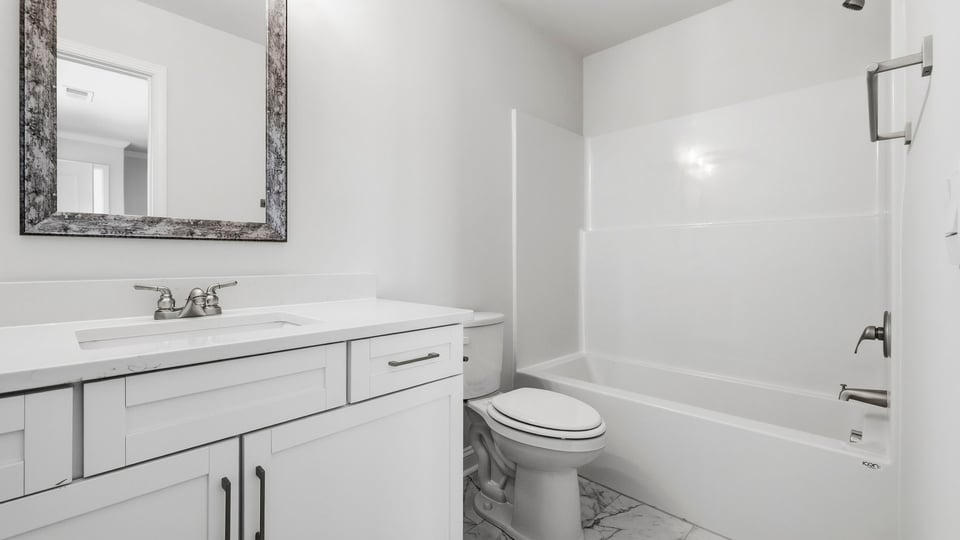 Bathroom with vanity sinks.