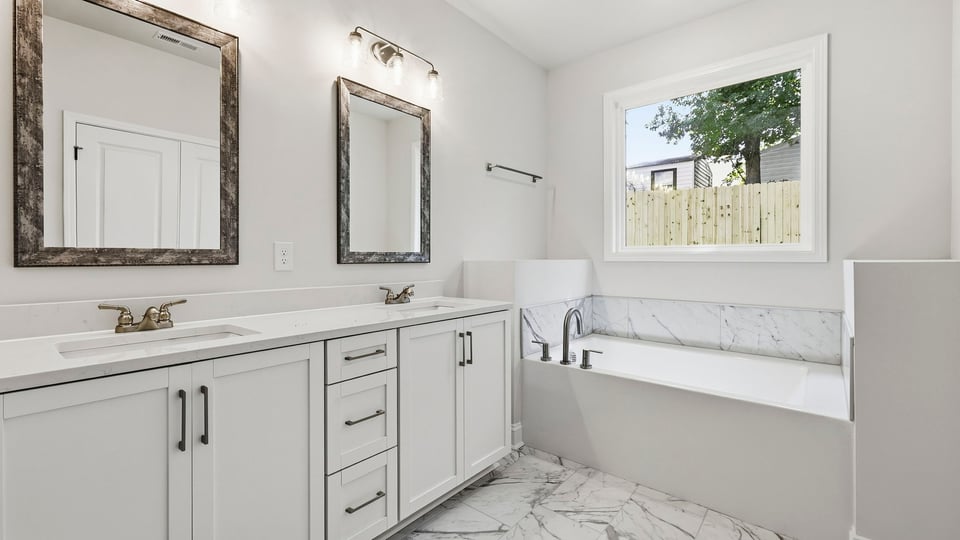 Primary bathroom with double vanity sinks.