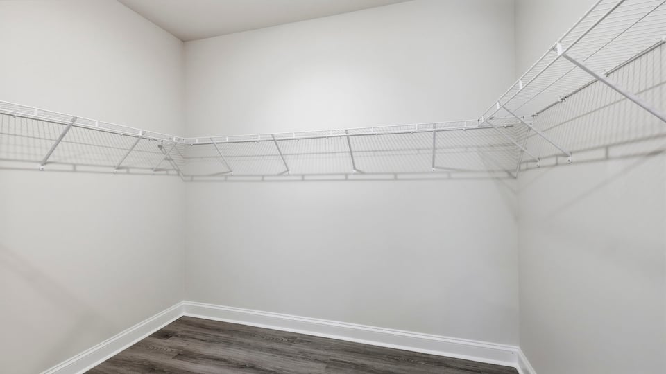 Primary closet with shelf.