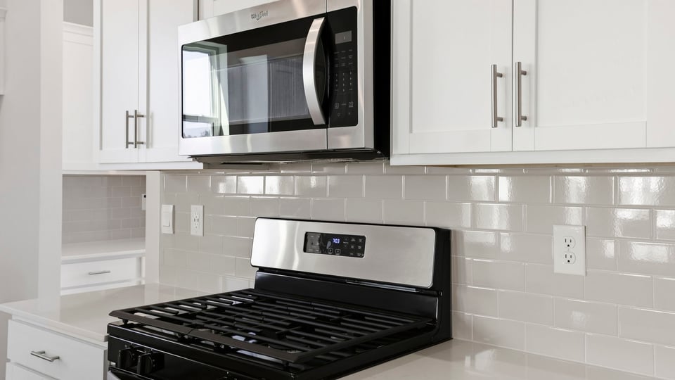 Kitchen with island and cabinets.
