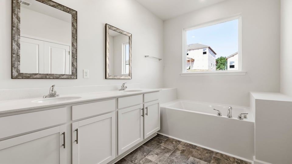Primary bathroom with double vanity sink.