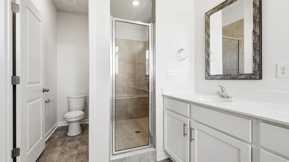 Primary bathroom with double vanity sink.