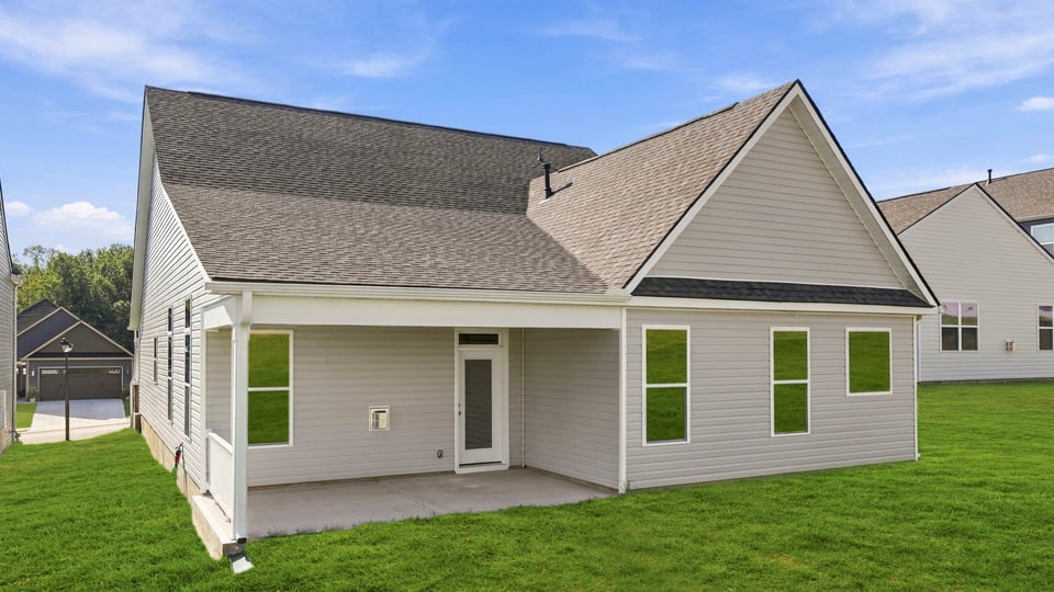 Back exterior with large backyard.