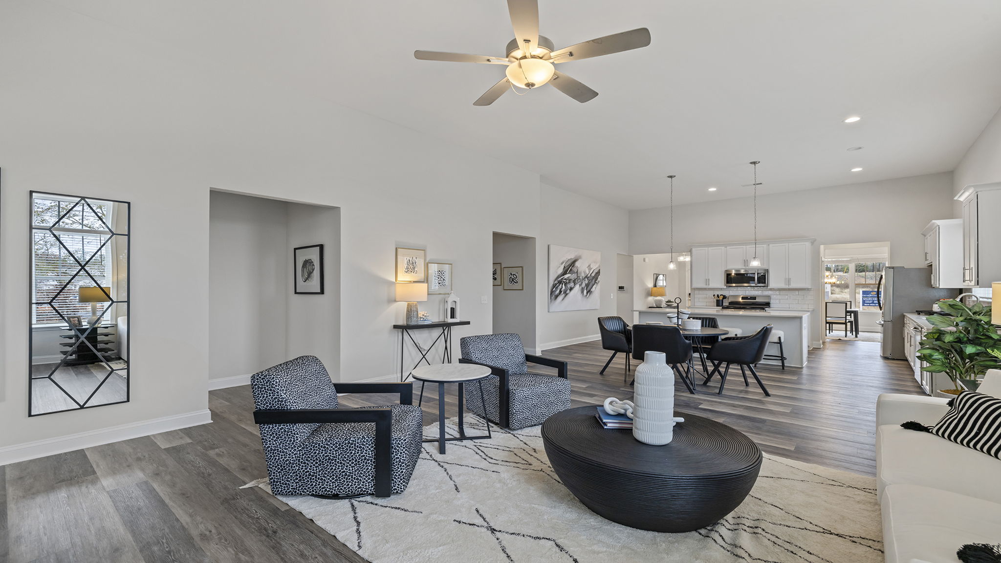Living area with fireplace and windows.