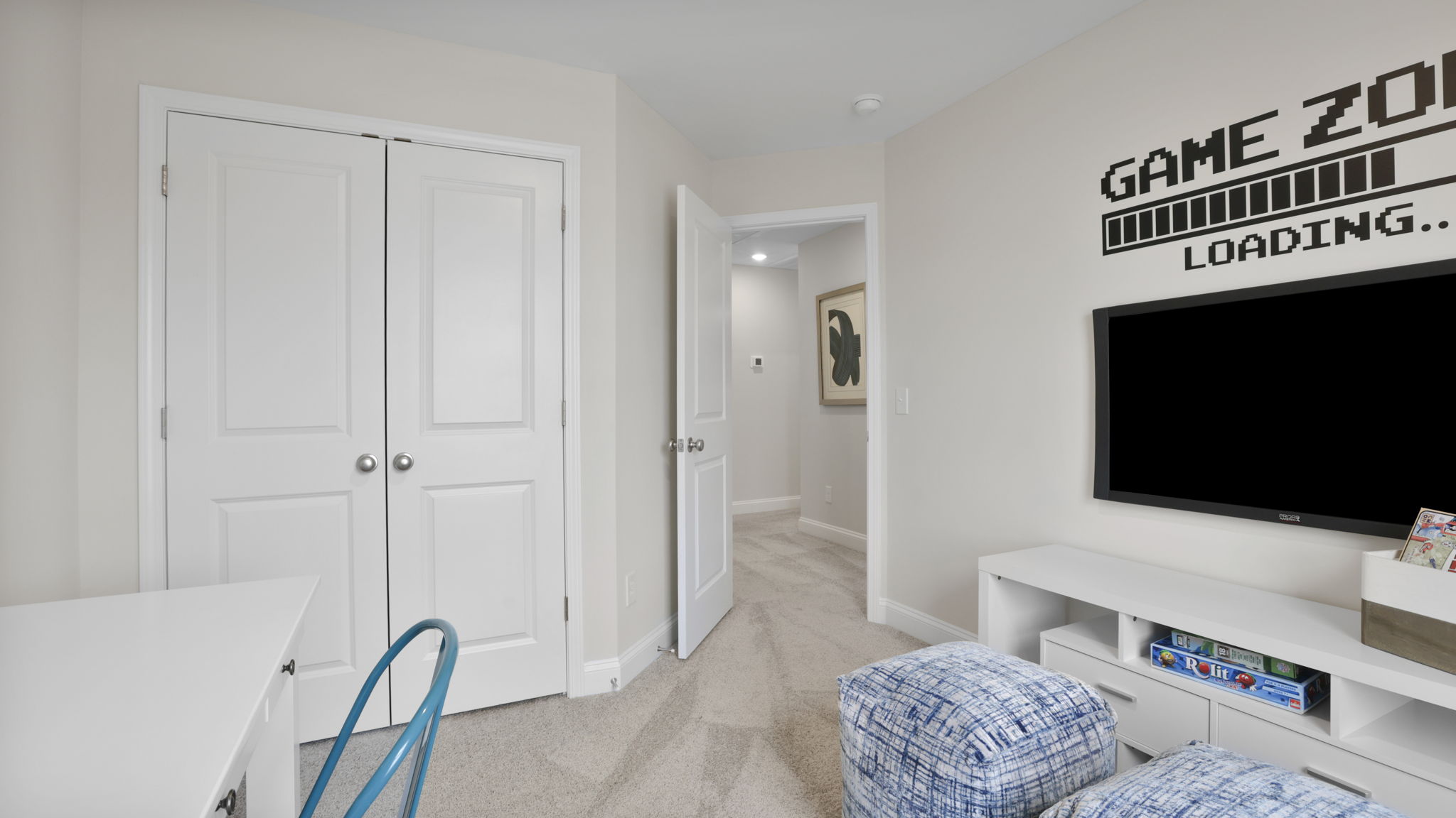 Bedroom with carpet and window.