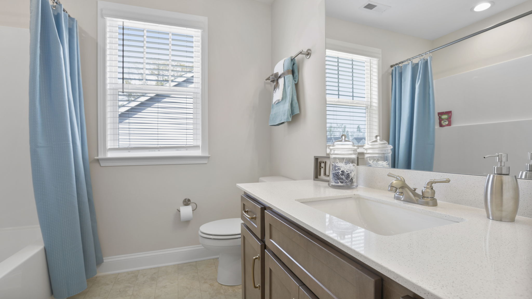 Bathroom with single vanity sink and window.