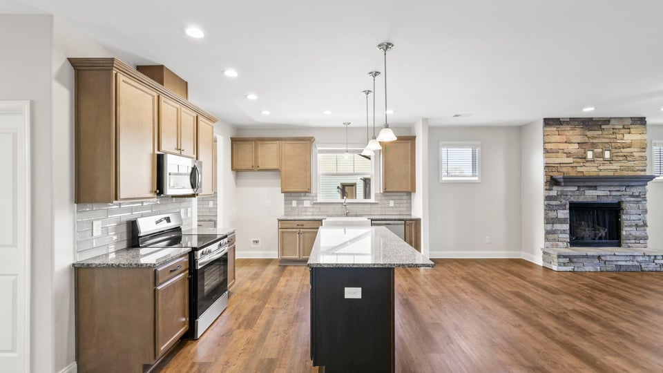 Kitchen with island and cabinets.