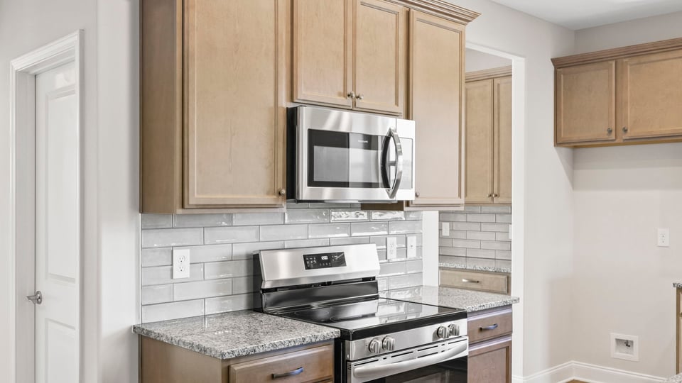 Kitchen with island and cabinets.