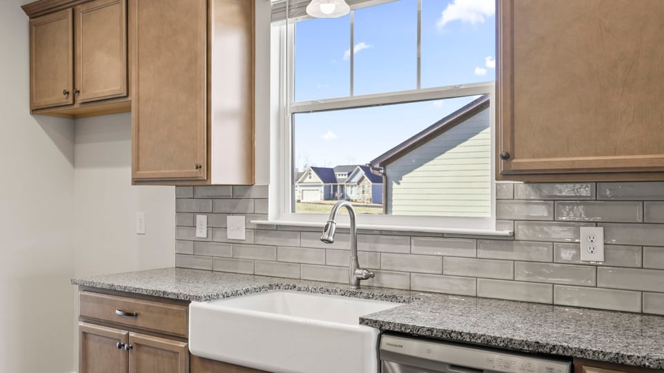 Kitchen with island and cabinets.