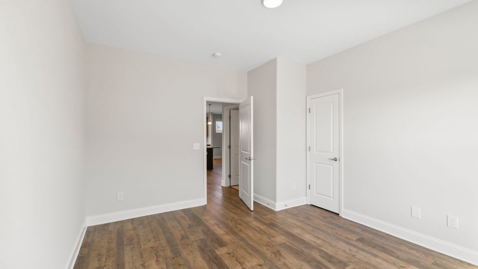 Bedroom with window and closet.