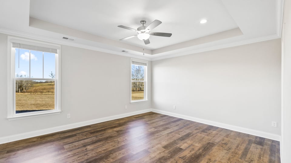 Primary bedroom with windows.
