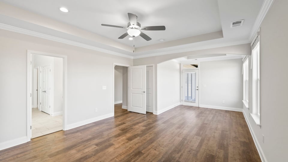 Primary bedroom with windows.