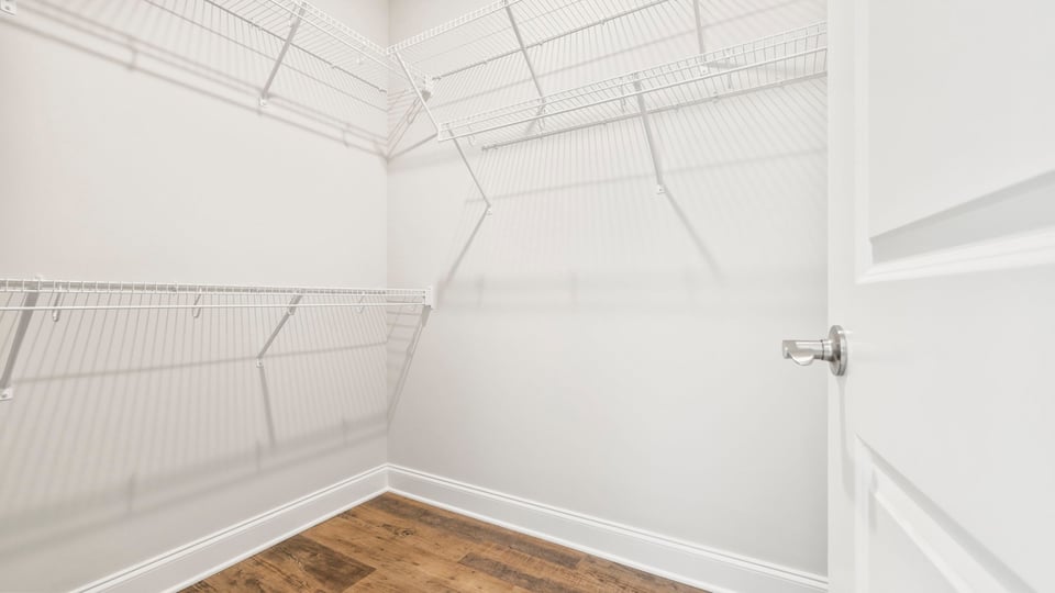 Primary closet with shelves.