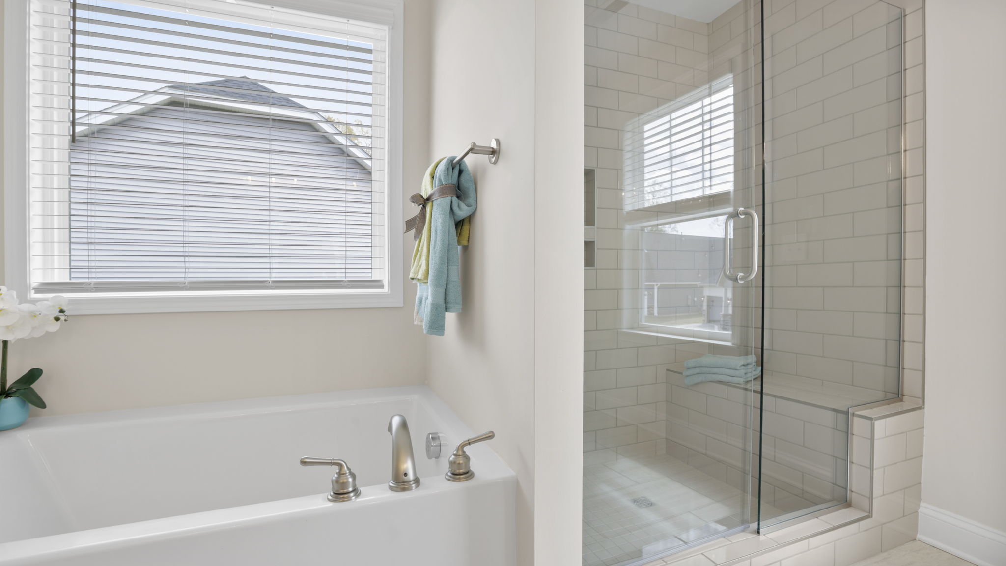 Bathroom with tub and walk in shower.