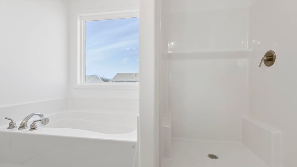 Primary bathroom with double vanity sinks.