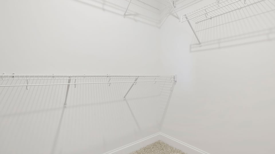 Primary closet with shelf.