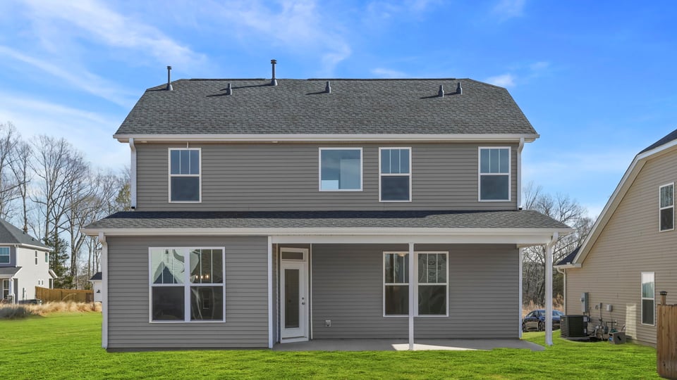 Back exterior with large backyard.