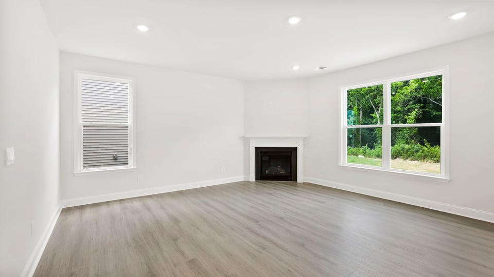 Family room with window and fireplace.