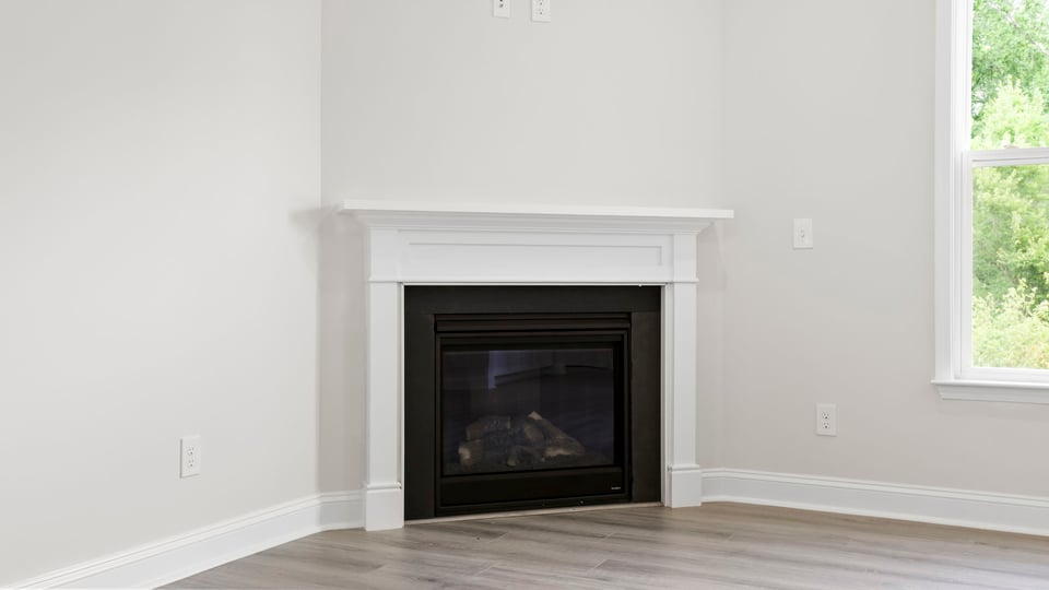 Family room with window and fireplace.