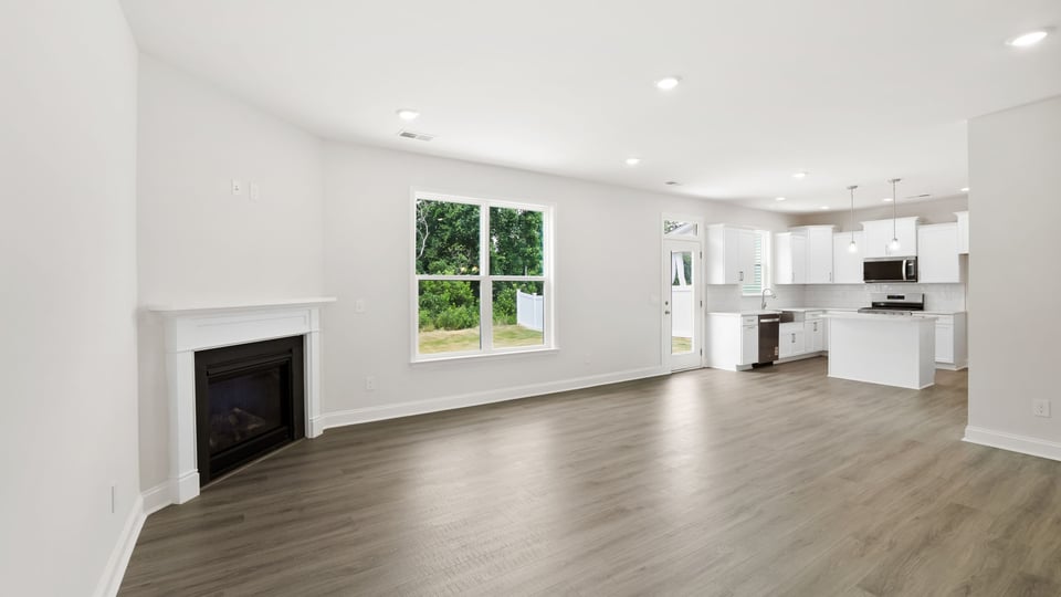 Family room with window and fireplace.