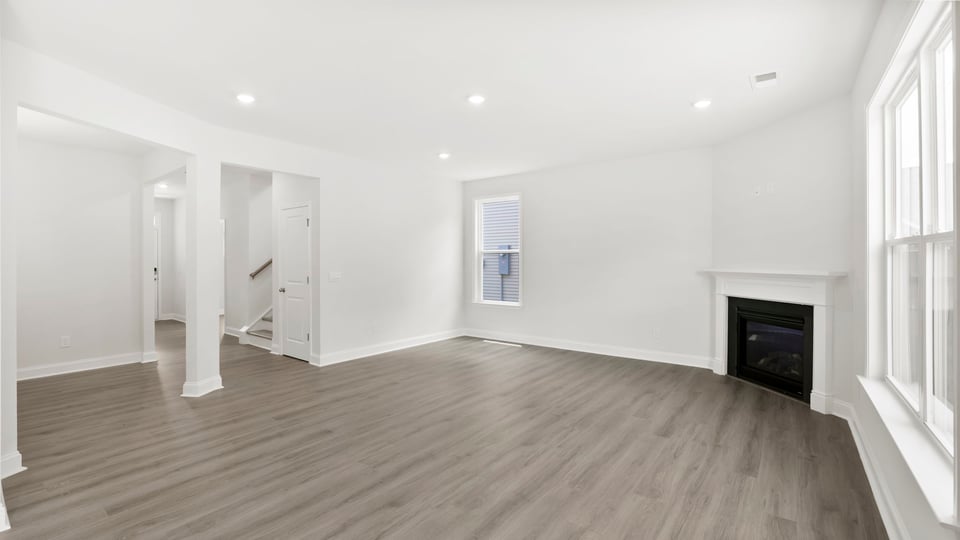 Family room with window and fireplace.