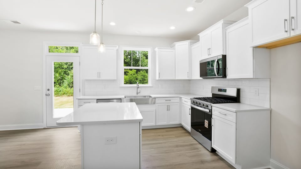 Kitchen with stainelss steel appliances.