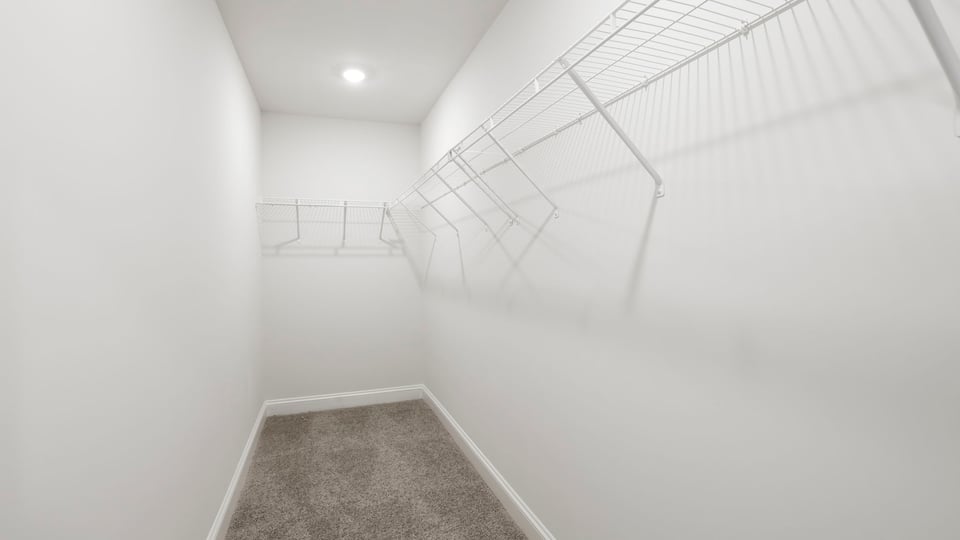 Closet with hanging storage racks.