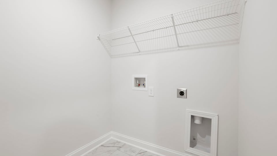 Laundry room with hanging storage racks.