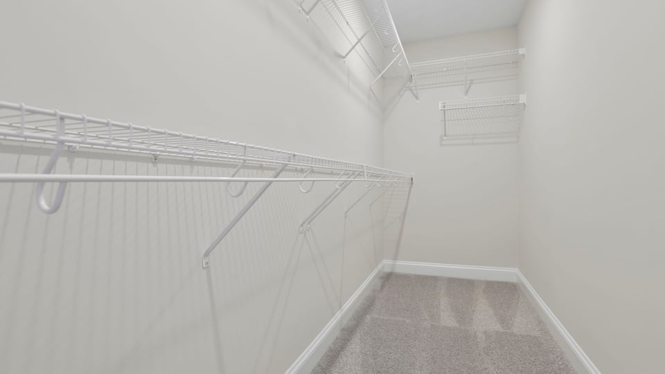Closet with hanging storage racks.
