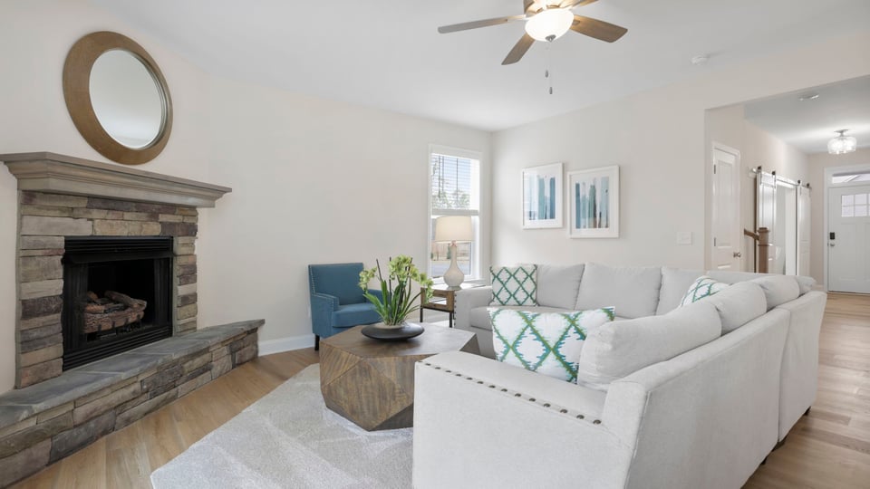 Living area with windows and fireplace.