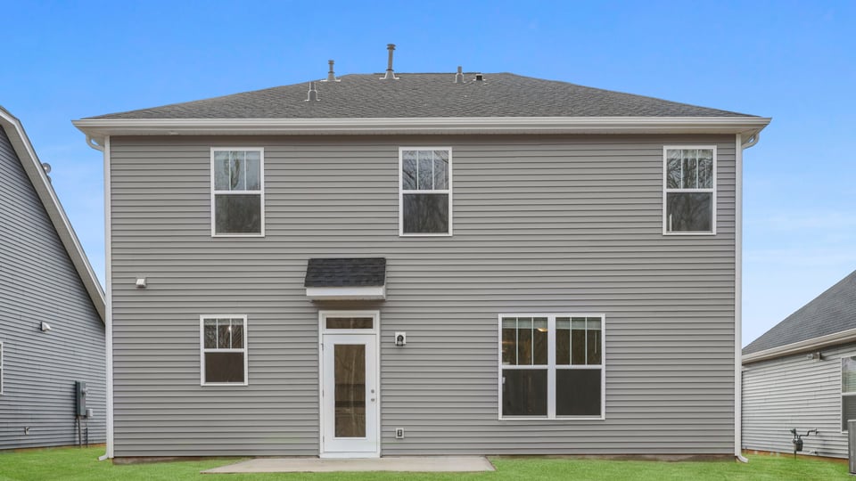 Back exterior with large backyard.