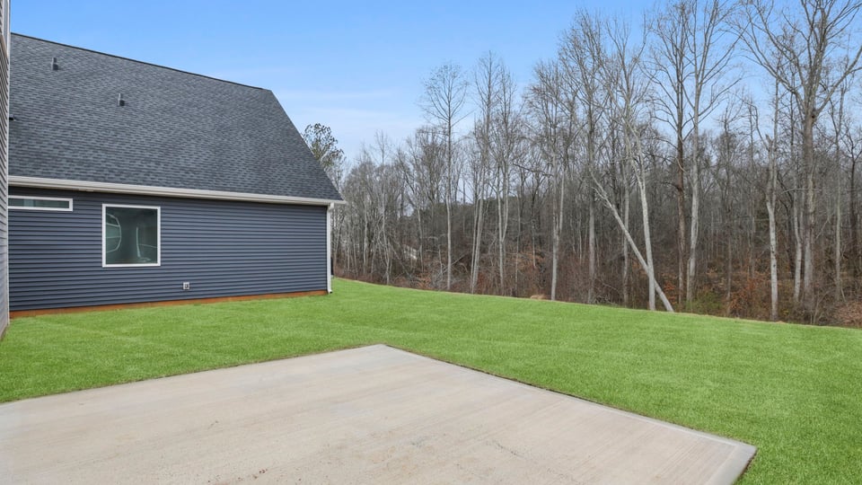 Back exterior with large backyard.