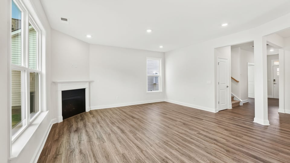 Family room with fireplace and windows.