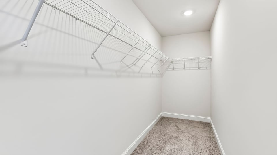 Closet with hanging storage racks.