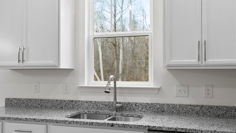 Kitchen with island and cabinets.