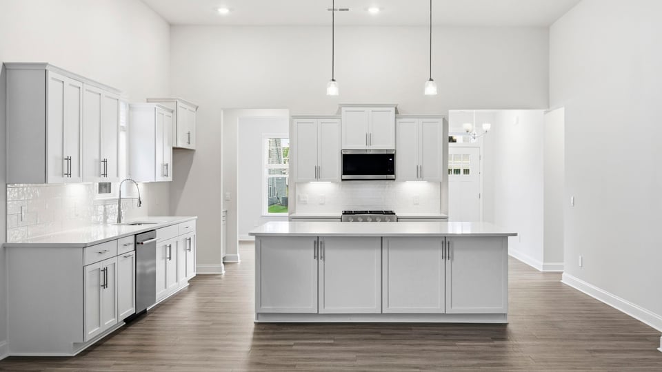 Kitchen with island and cabinets.