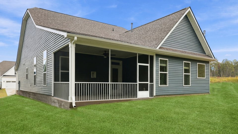 Back exterior with large backyard.