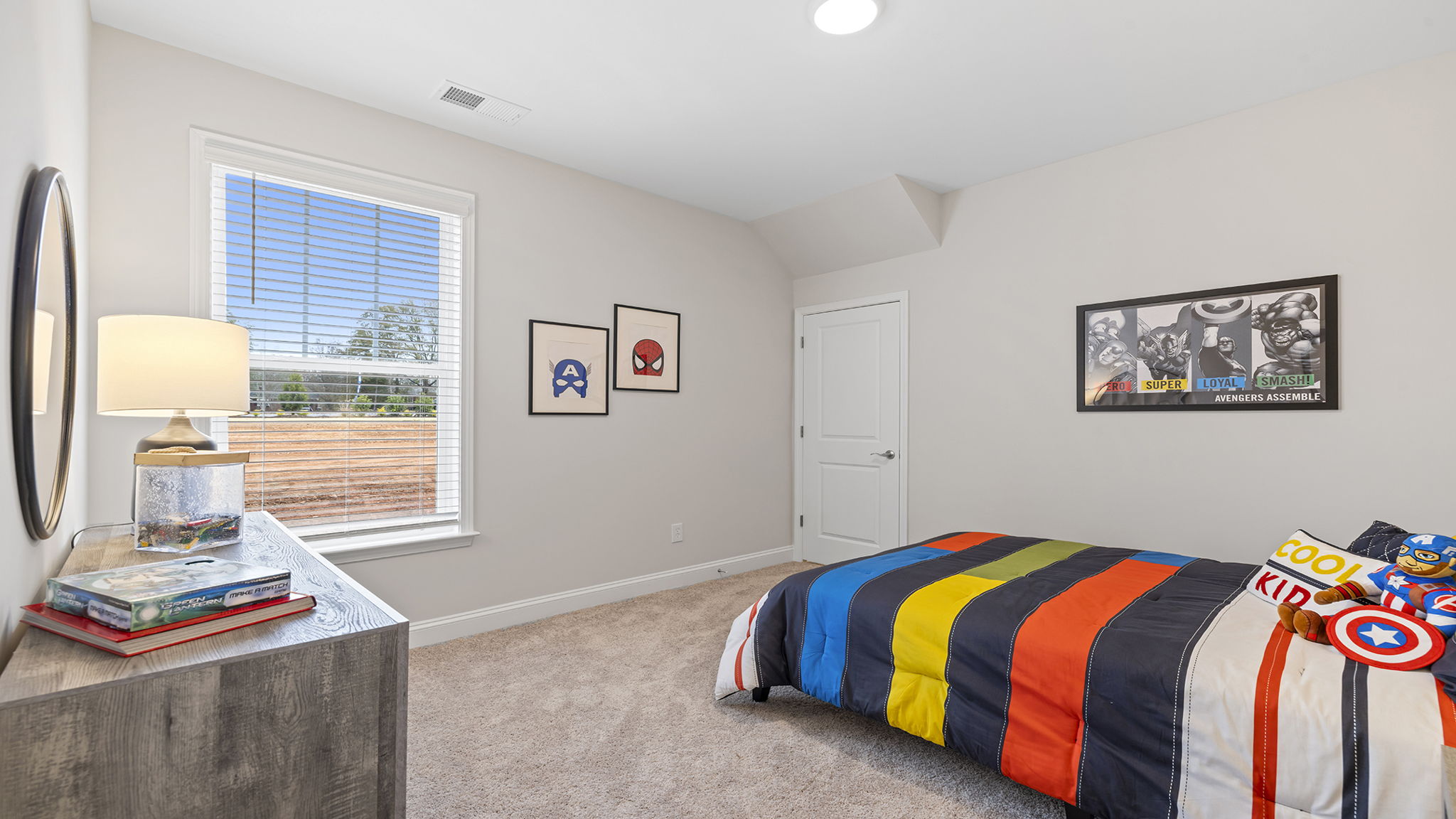 Bedroom with carpet and windows.