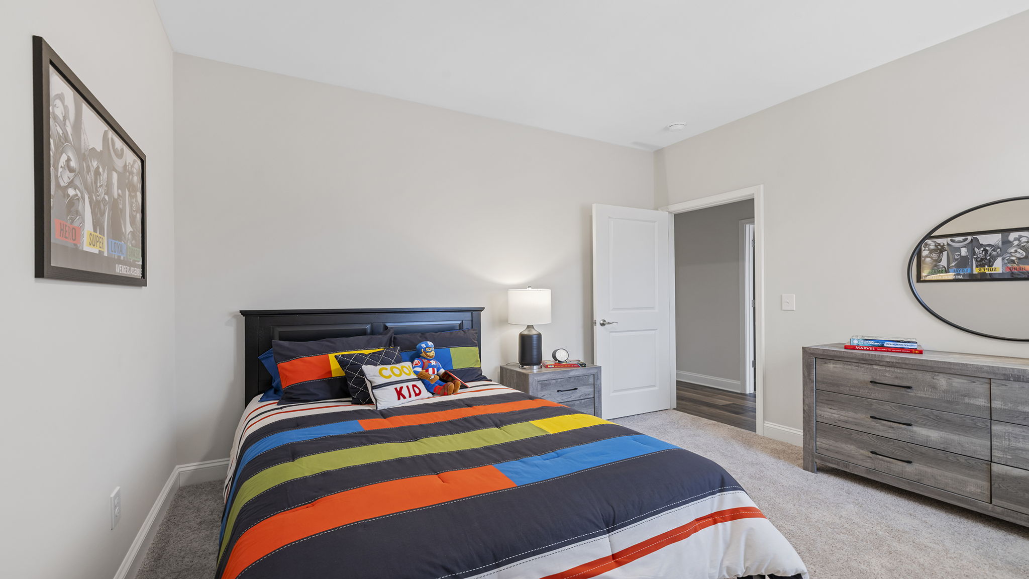 Bedroom with carpet and windows.