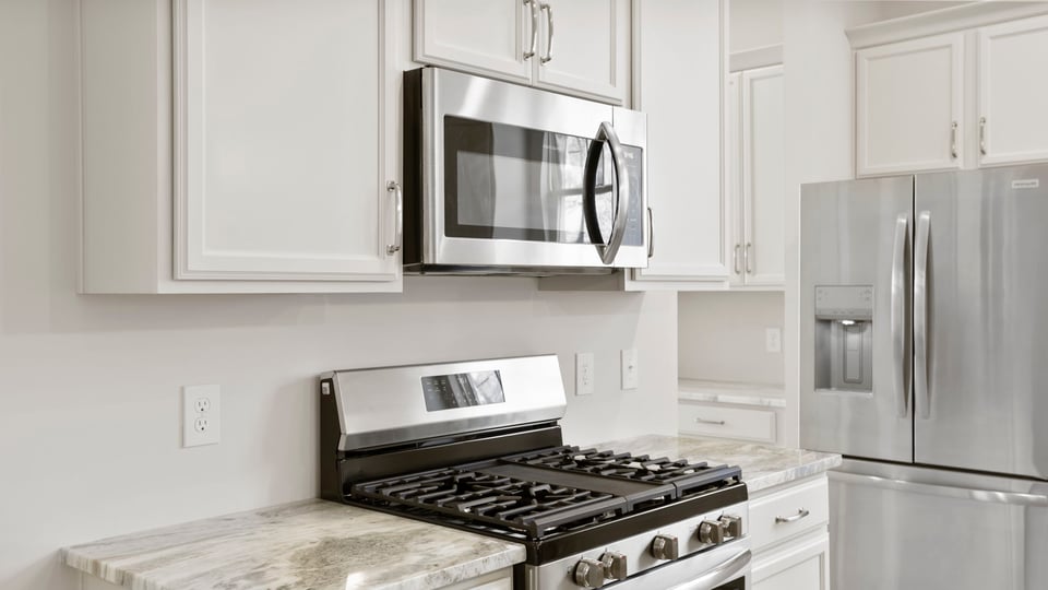 Kitchen with island and cabinets.