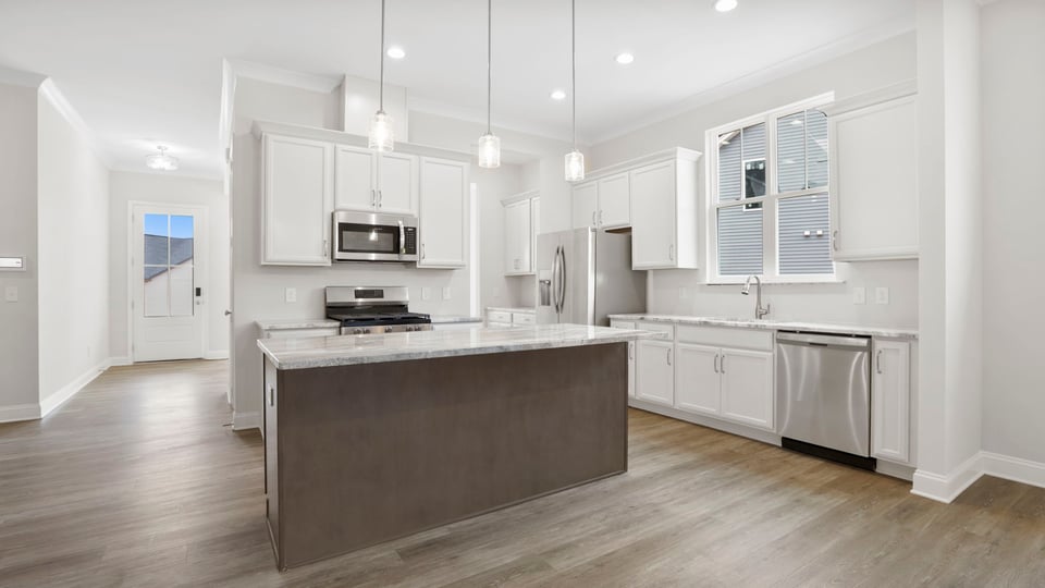 Kitchen with island and cabinets.