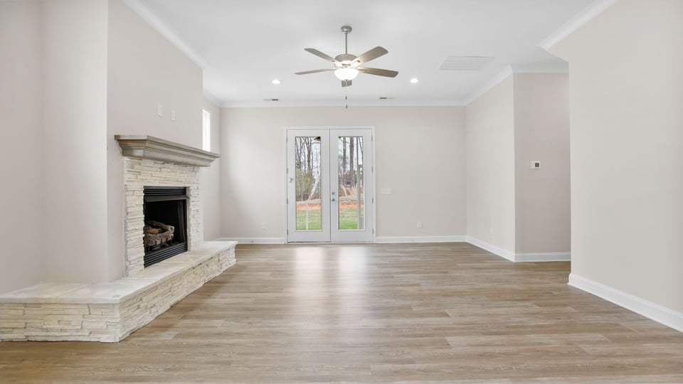 Living area with windows and fireplace.