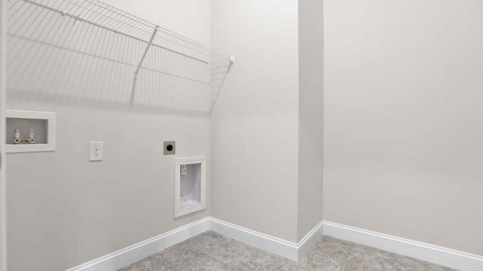 Laundry room with shelf.