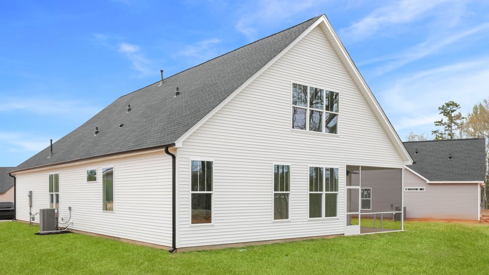Back exterior with large backyard.
