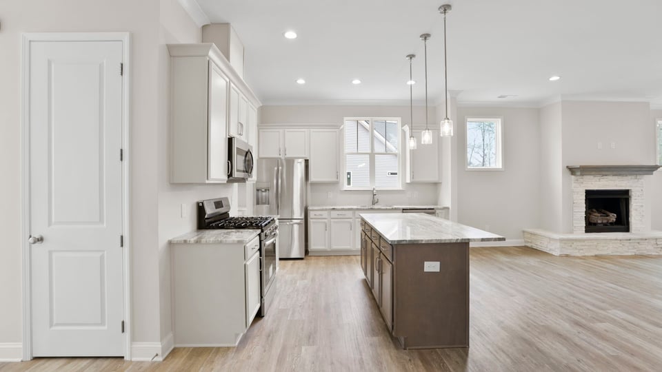 Kitchen with island and cabinets.