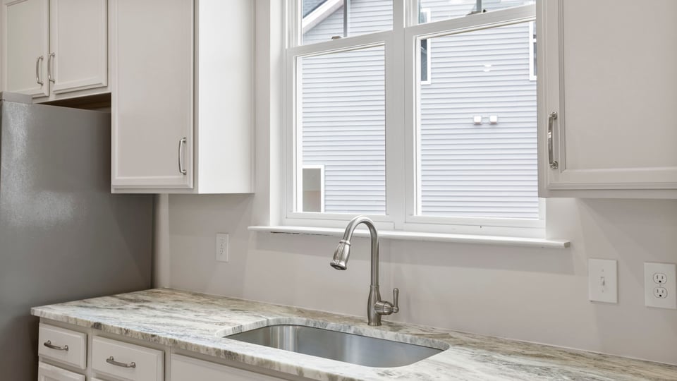 Kitchen with island and cabinets.